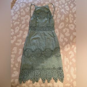 Lulus open back light teal dress.